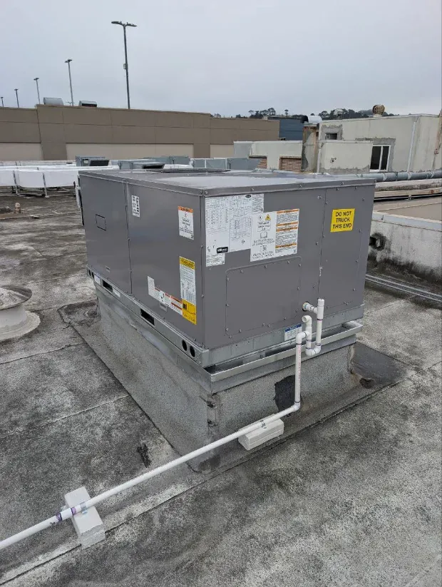 Rooftop packaged HVAC unit Sunny services on a commercial building