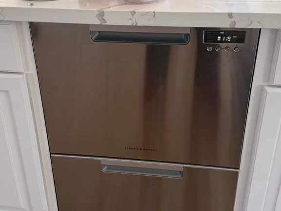 Fisher & Paykel double DishDrawer dishwasher fitted under a kitchen counter, of the kind Sunny repairs