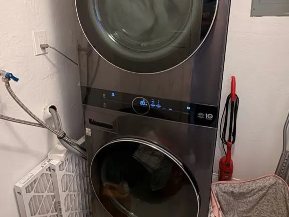 Stacked LG WashTower washer and dryer in a Bay Area laundry room, of the kind Sunny repairs